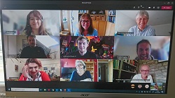 New PhD students smiling during an online meeting