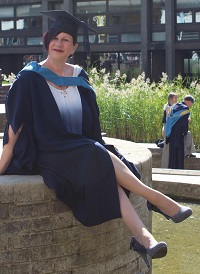 Susan at graduation ceremony