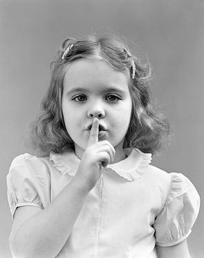 child signalling to be quiet 