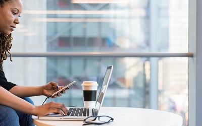 Photo by Christina @ wocintechchat.com on Unsplash - woman learning online using a range of digital devices