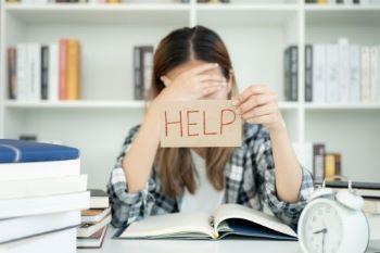 women with a help sign 