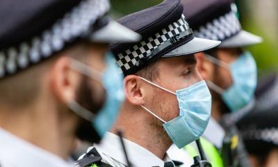 Police officers wearing face masks