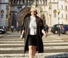 Photo of Zahra Alidina walking from the Royal Courts of Justice by photographer Chris Floyd
